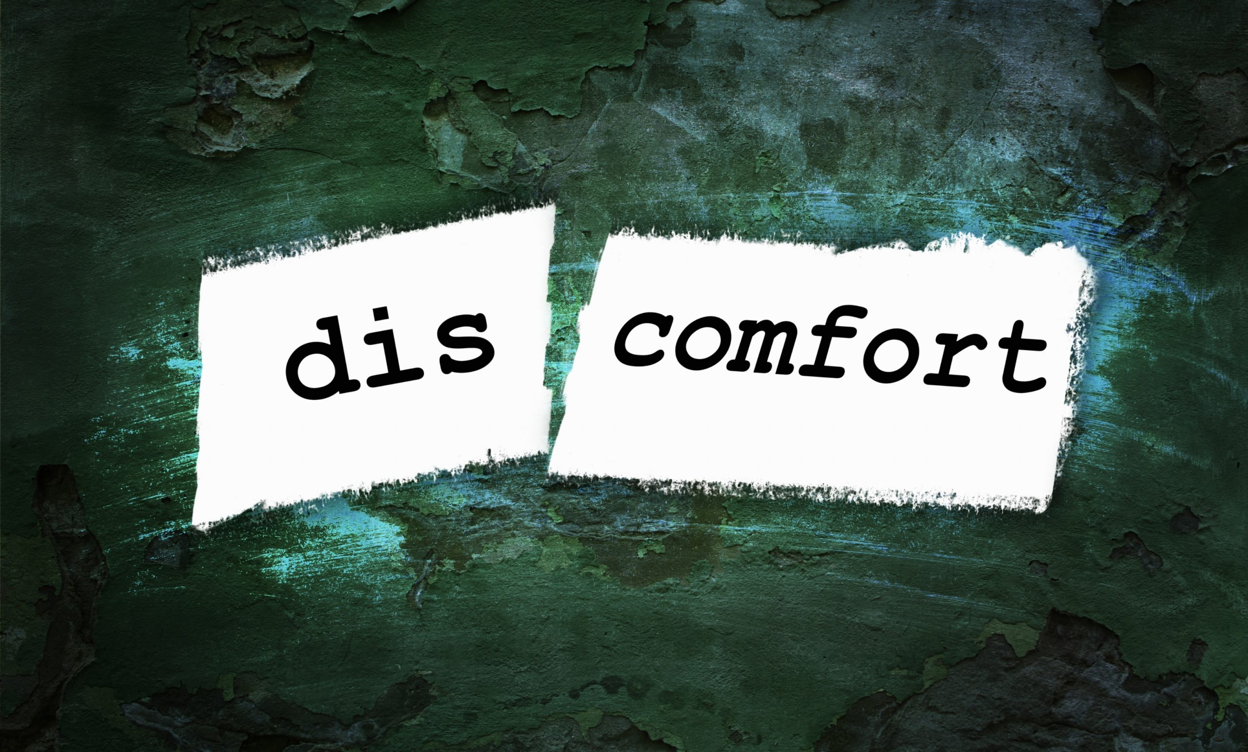 The word "discomfort" split into "dis" and "comfort", in front of a green background